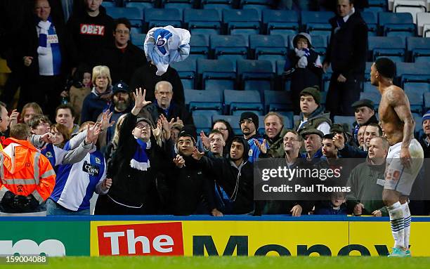 Blackburn fans scramble to catch the shirt thrown into the crowd by Colin Kazim-Richards of Blackburn after the FA Cup with Budweiser Third Round...