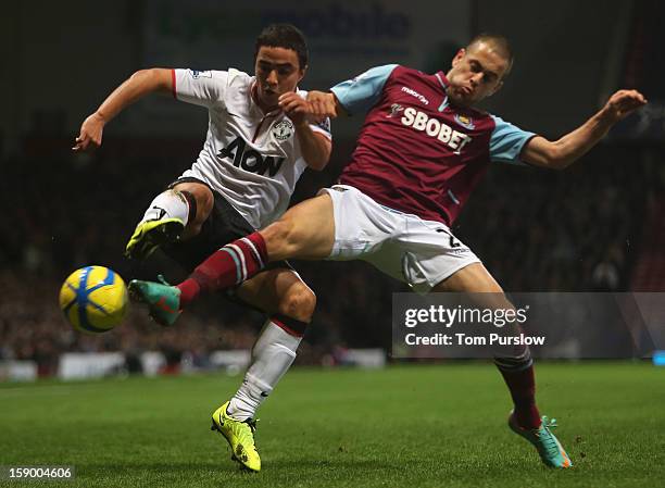 Rafael da Silva of Manchester United in action with Joe Cole of West Ham United during the FA Cup Third Round match between West Ham United and...