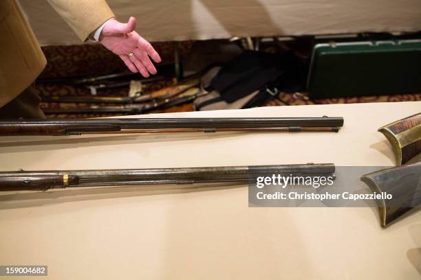 Guns are displayed at a gun show held by Westchester Collectors Inc. At the Crowne Plaza Hotel on January 5, 2013 in Stamford, Connecticut. While...