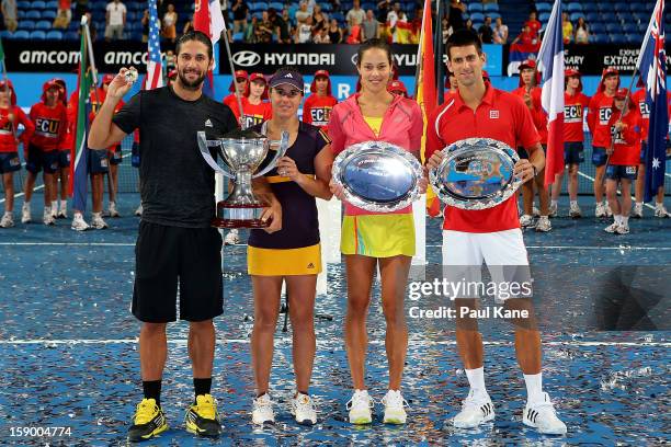 Fernando Verdasco and Anabel Medina Garrigues of Spain together with Ana Ivanovic and Novak Djokovic of Serbia pose with their trophies after the...