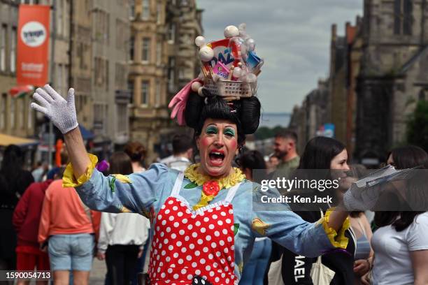 Performer promotes a show on the Royal Mile during the Edinburgh Festival Fringe, on August 10, 2023 in Edinburgh, Scotland.