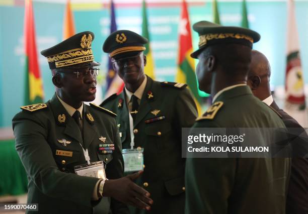 Members of the Armed Forces of Senegal discuss on the sidelines of the Economic Community of West African States Head of States and Government...