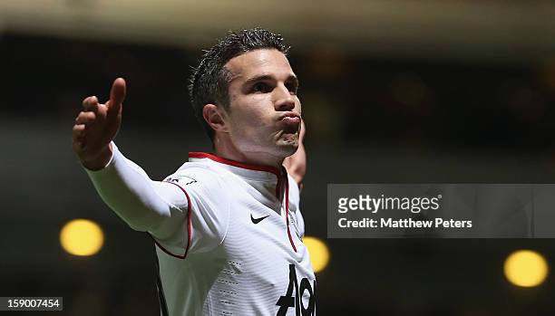 Robin van Persie of Manchester United celebrates scoring their second goal during the FA Cup Third Round match between West Ham United and Manchester...