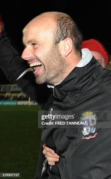 Plabennec's coach Franck Kerdiles celebrates after winning a French Cup football match Plabennec vs Reims on January 5, 2013 in Plabennec, western...