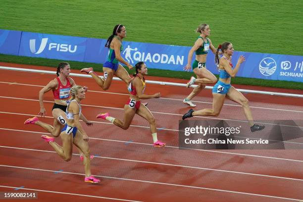 Patrizia van der Weken of Team Luxembourg leads in the Athletics - Women's 100m Final on day 5 of 31st FISU Summer World University Games at...