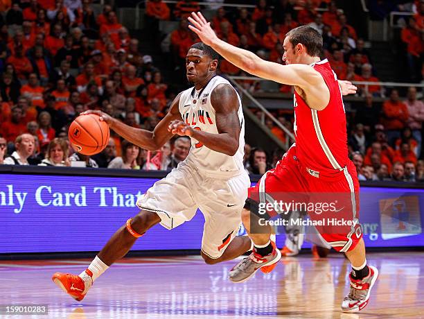 Brandon Paul of the Illinois Fighting Illini dribbles the ball against Aaron Craft of the Ohio State Buckeyes at Assembly Hall on January 5, 2013 in...