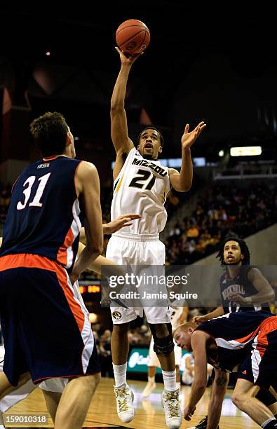 Laurence Bowers of the Missouri Tigers shoots over Mike Muscala of the Bucknell Bison during the game at Mizzou Arena on January 5, 2013 in Columbia,...