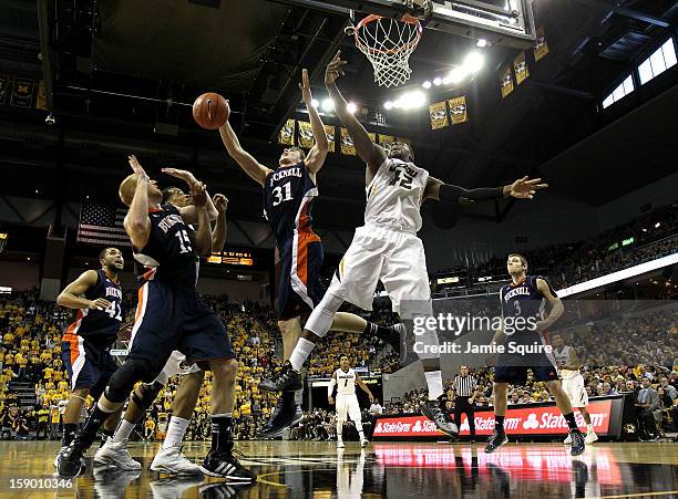 Alex Oriakhi of the Missouri Tigers battles Mike Muscala of the Bucknell Bison for a rebound during the game at Mizzou Arena on January 5, 2013 in...