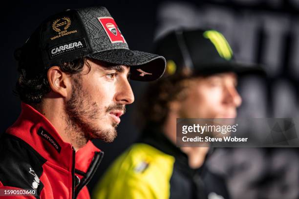 Francesco Bagnaia of Italy and Ducati Lenovo Team sits next to Marco Bezzecchi of Italy and Mooney VR46 Racing Team at the press conference ahead of...