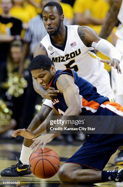 Missouri's Keion Bell, back, attempts to strip the ball from Bucknell's Ryan Hill in the first half at Mizzou Arena in Columbia, Missouri, Saturday,...