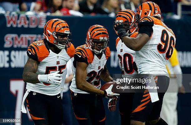 Vontaze Burfict, Leon Hall, Reggie Nelson and Carlos Dunlap of the Cincinnati Bengals celebrate after Hall returned an interception 21-yards for a...
