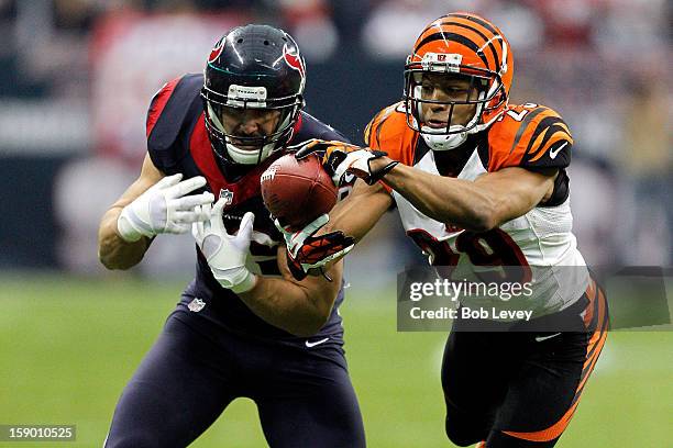 Leon Hall of the Cincinnati Bengals intercepts a pass and returns it 21-yards for a touchdown in the second quarter against James Casey of the...