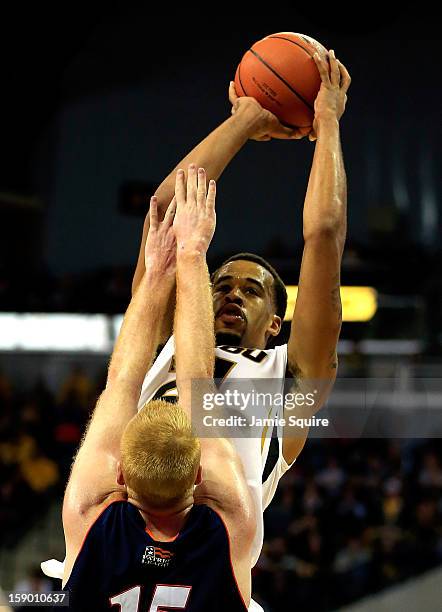 Laurence Bowers of the Missouri Tigers shoots over Joe Willman of the Bucknell Bison during the game at Mizzou Arena on January 5, 2013 in Columbia,...