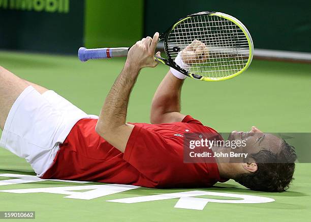 Richard Gasquet of France celebrates his victory after his final against Nikolay Davydenko of Russia on day six of the Qatar Open 2013 at the Khalifa...