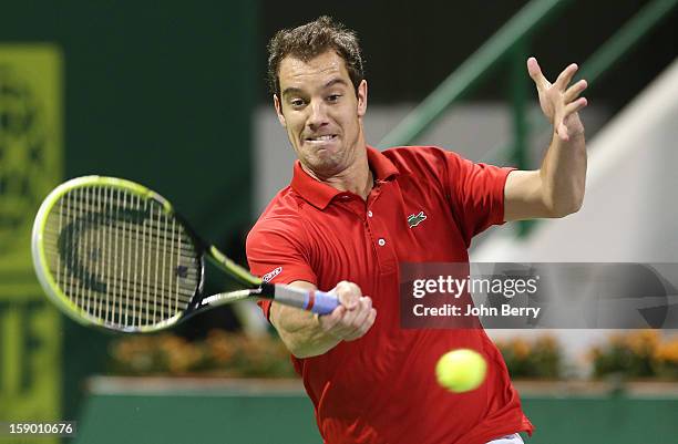 Richard Gasquet of France plays a forehand during the final against Nikolay Davydenko of Russia in day six of the Qatar Open 2013 at the Khalifa...