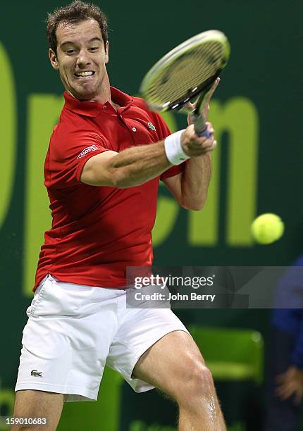 Richard Gasquet of France plays a forehand during the final against Nikolay Davydenko of Russia in day six of the Qatar Open 2013 at the Khalifa...