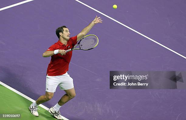 Richard Gasquet of France serves during the final against Nikolay Davydenko of Russia in day six of the Qatar Open 2013 at the Khalifa International...