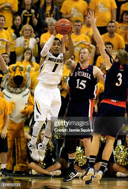 Phil Pressey of the Missouri Tigers grabs an offensive rebound during the game against the Bucknell Bison at Mizzou Arena on January 5, 2013 in...
