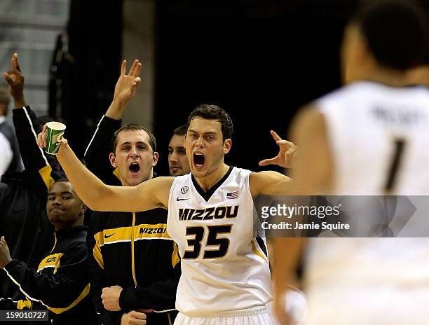 Stefan Jankovic of the Missouri Tigers reacts from the bench alnogside teammates after Phil Pressey made a three-pointer during the game against the...