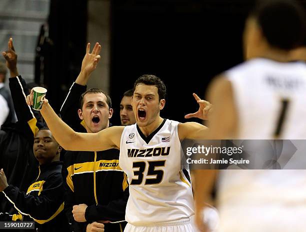 Stefan Jankovic of the Missouri Tigers reacts from the bench alnogside teammates after Phil Pressey made a three-pointer during the game against the...