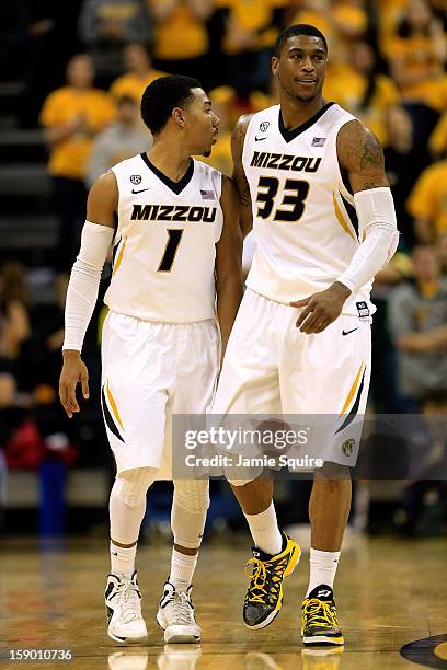 Phil Pressey and Earnest Ross of the Missouri Tigers react during the game against the Bucknell Bison at Mizzou Arena on January 5, 2013 in Columbia,...