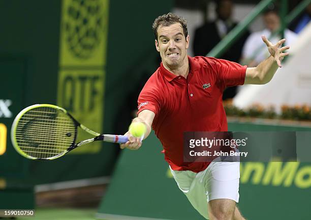 Richard Gasquet of France plays a forehand during the final against Nikolay Davydenko of Russia on day six of the Qatar Open 2013 at the Khalifa...