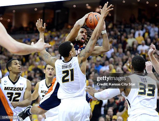 Bucknell's Bryson Johnson turns the ball over late in the game as he drives to the bucket against Missouri's Laurence Bowers in the second half at...