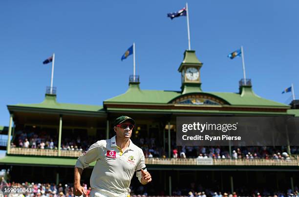 Michael Hussey of Australia leads his team onto the field during his last test during day four of the Third Test match between Australia and Sri...