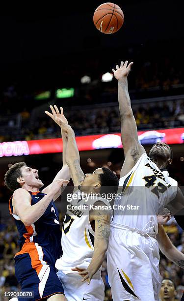 Bucknell's Mike Muscala takes a leaner over Missouri defenders Laurence Bowers and Alex Oriakhi in the second half at Mizzou Arena in Columbia,...