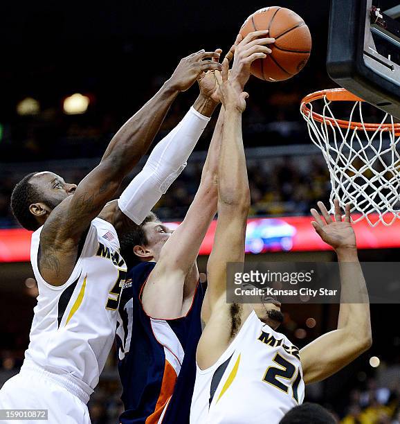 Missouri's Keion Bell, left, and Laurence Bowers, right, battle Bucknell's Mike Muscala for a rebound in the second half at Mizzou Arena in Columbia,...