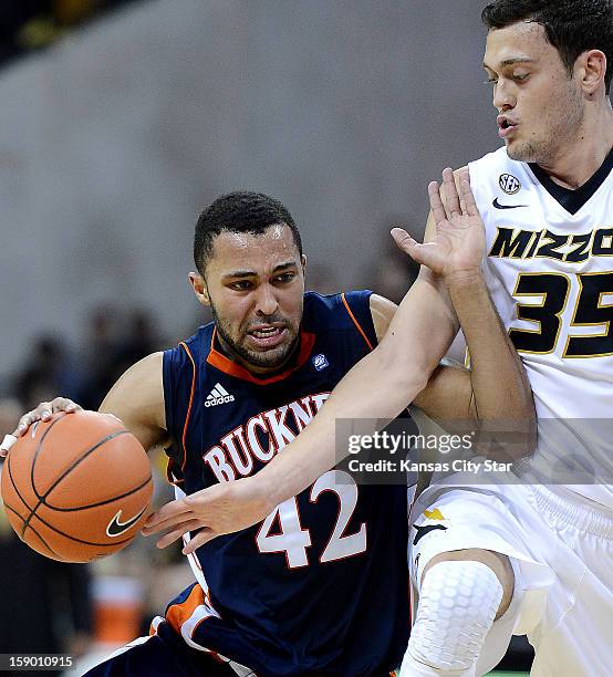 Missouri defender Stefan Jankovic leans into Bucknell's Cameron Ayers as he drives to the basket in the second half at Mizzou Arena in Columbia,...