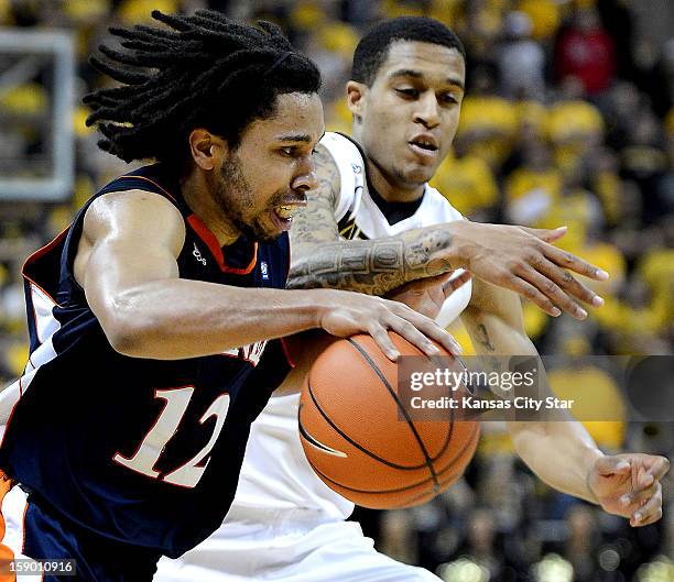 Bucknell's Bryson Johnson tries to drive past Missouri's Jabari Brown in the second half at Mizzou Arena in Columbia, Missouri, Saturday, January 5,...