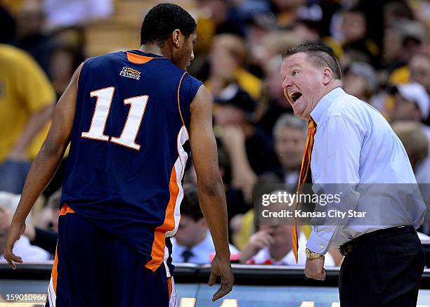 Bucknell coach Dave Paulsen, right, makes his point to Ryan Hill during the second half against Missouri at Mizzou Arena in Columbia, Missouri,...