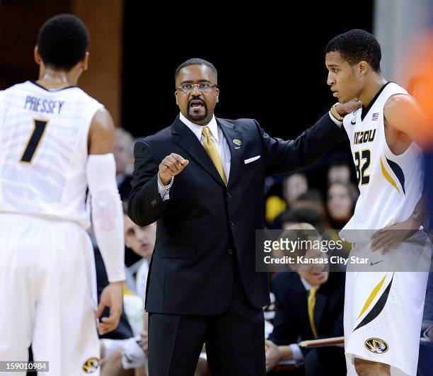 Missouri coach Frank Haith huddles up with Phil Pressey and Jabari Brown during the first half against Bucknell at Mizzou Arena in Columbia,...