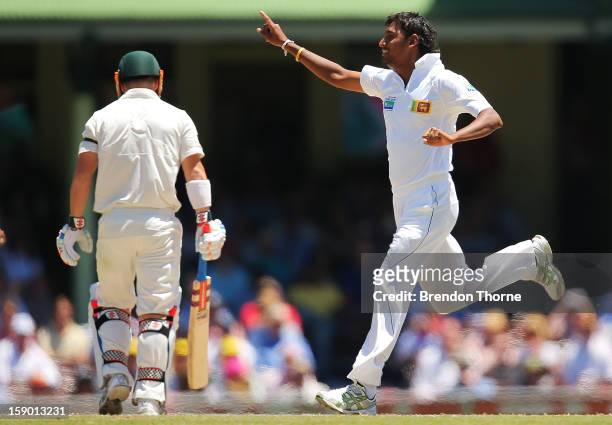 Suranga Lakmal of Sri Lanka celebrates after claiming the wicket of David Warner of Australia during day four of the Third Test match between...