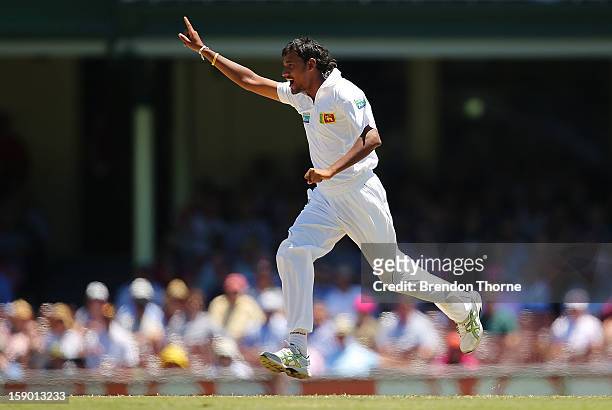 Suranga Lakmal of Sri Lanka celebrates after claiming the wicket of David Warner of Australia during day four of the Third Test match between...