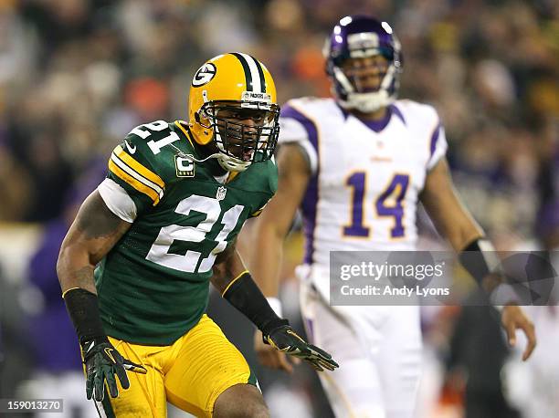 Safety Charles Woodson of the Green Bay Packers reacts in front of quarterback Joe Webb of the Minnesota Vikings after the Packers stop the Vikings...