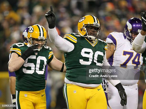 Tackle B.J. Raji of the Green Bay Packers reacts after a defensive play in the first half against the Minnesota Vikings during the NFC Wild Card...