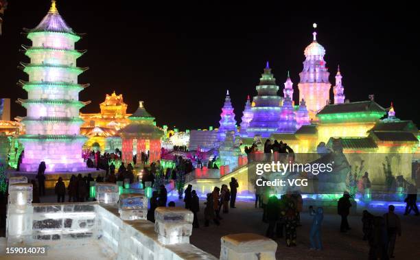 Tourists visit the opening of the 29th Harbin International Ice and Snow Festival, touted as the world's biggest ice and snow festival, on January 5,...
