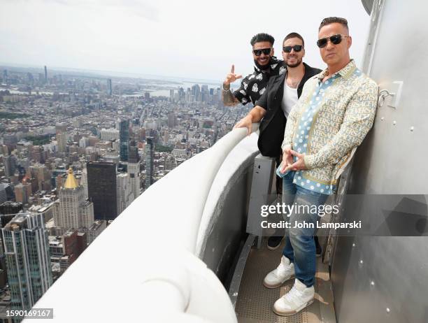 Paul "DJ Pauly D" DelVecchio, Vinny Guadagnino and Mike "The Situation" Sorrentino visit The Empire State Building on August 03, 2023 in New York...