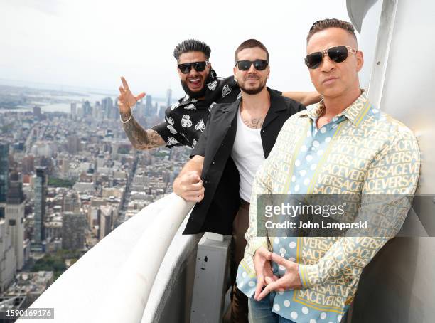 Paul "DJ Pauly D" DelVecchio, Vinny Guadagnino and Mike "The Situation" Sorrentino visit The Empire State Building on August 03, 2023 in New York...