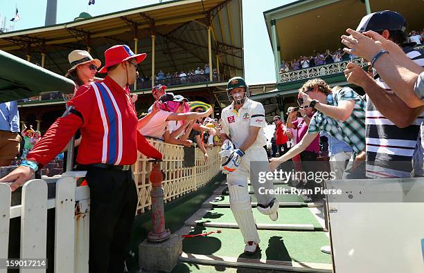 Michael Hussey of Australia walks out to bat for the last time in his Test career during day four of the Third Test match between Australia and Sri...