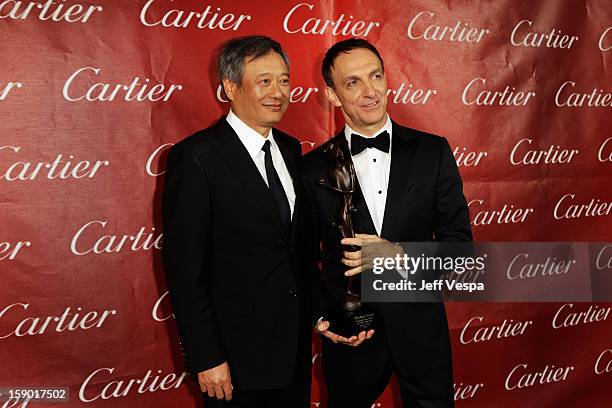 Director Ang Lee and composer Mychael Danna pose with the Frederick Loewe Award for Film Composing at the 24th annual Palm Springs International Film...