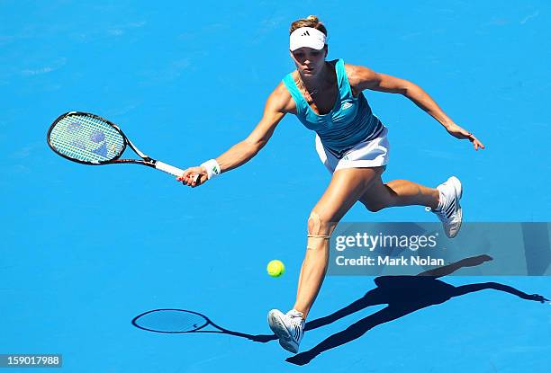 Maria Kirilenko of Russia plays a forehand in her first round match against Olivia Rogowska of Australia during day one of the Sydney International...