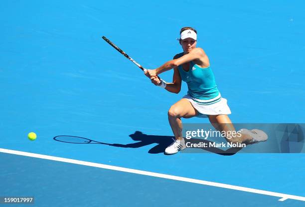 Maria Kirilenko of Russia plays a backhand in her first round match against Olivia Rogowska of Australia during day one of the Sydney International...