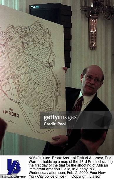 Bronx Assitant District Attorney, Eric Warner, holds up a map of the 43rd Precinct during the first day of the trial for the shooting of African...