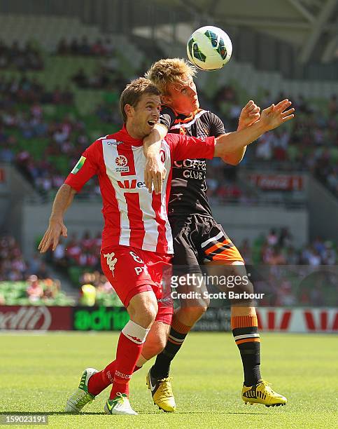 Matt Thompson of the Heart and Ben Halloran of the Roar compete for the ball during the round 15 A-League match between the Melbourne Heart and the...