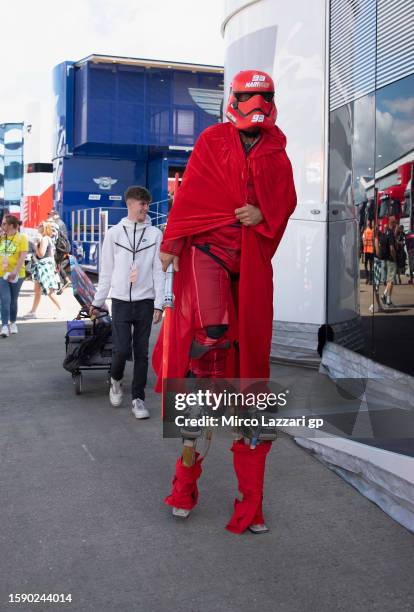 Fan walks in the paddock ahead of the MotoGP of Great Britain - Previews at Silverstone Circuit on August 03, 2023 in Northampton, England.