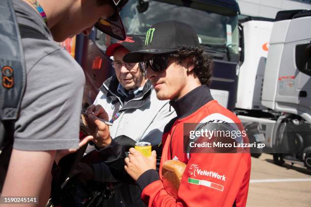 Celestino Vietti Ramus of Italy and Fantic Racing signs autographs for fans during the "Two Wheels For Life" event in the paddock ahead of the MotoGP...