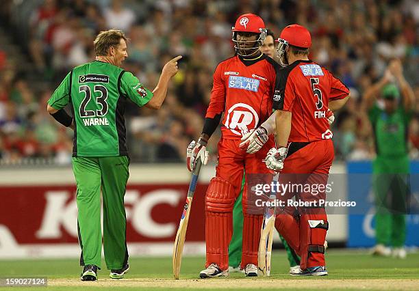 Shane Warne of the Stars points his finger towards Marlon Samuels of the Stars during the Big Bash League match between the Melbourne Stars and the...